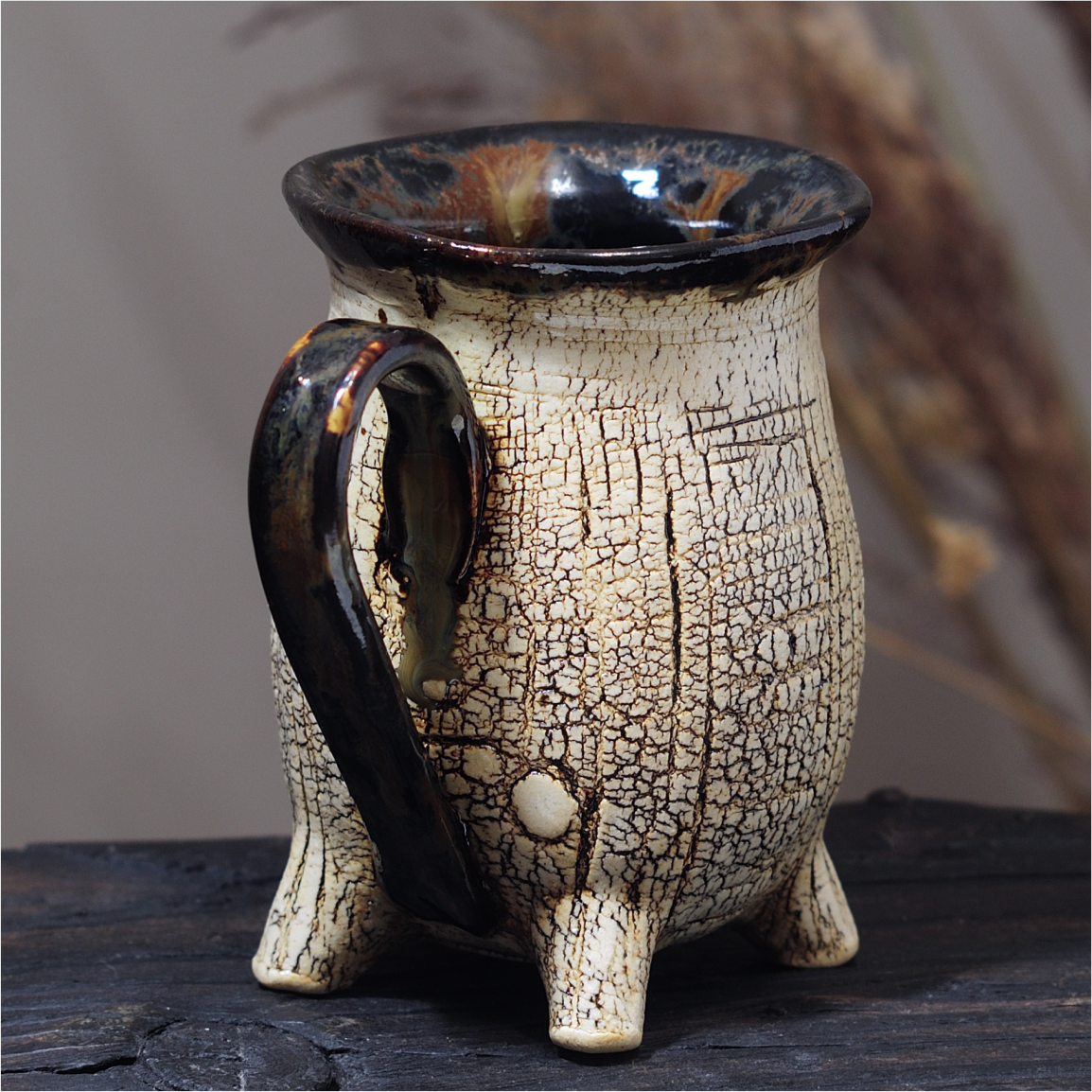 handmade ceramic footed mug side view