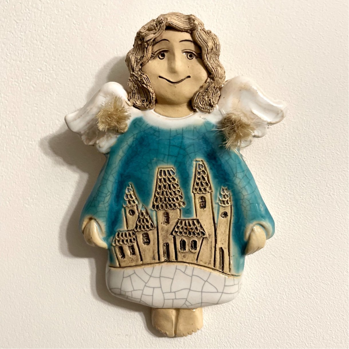 blue ceramic angel wall decor front view