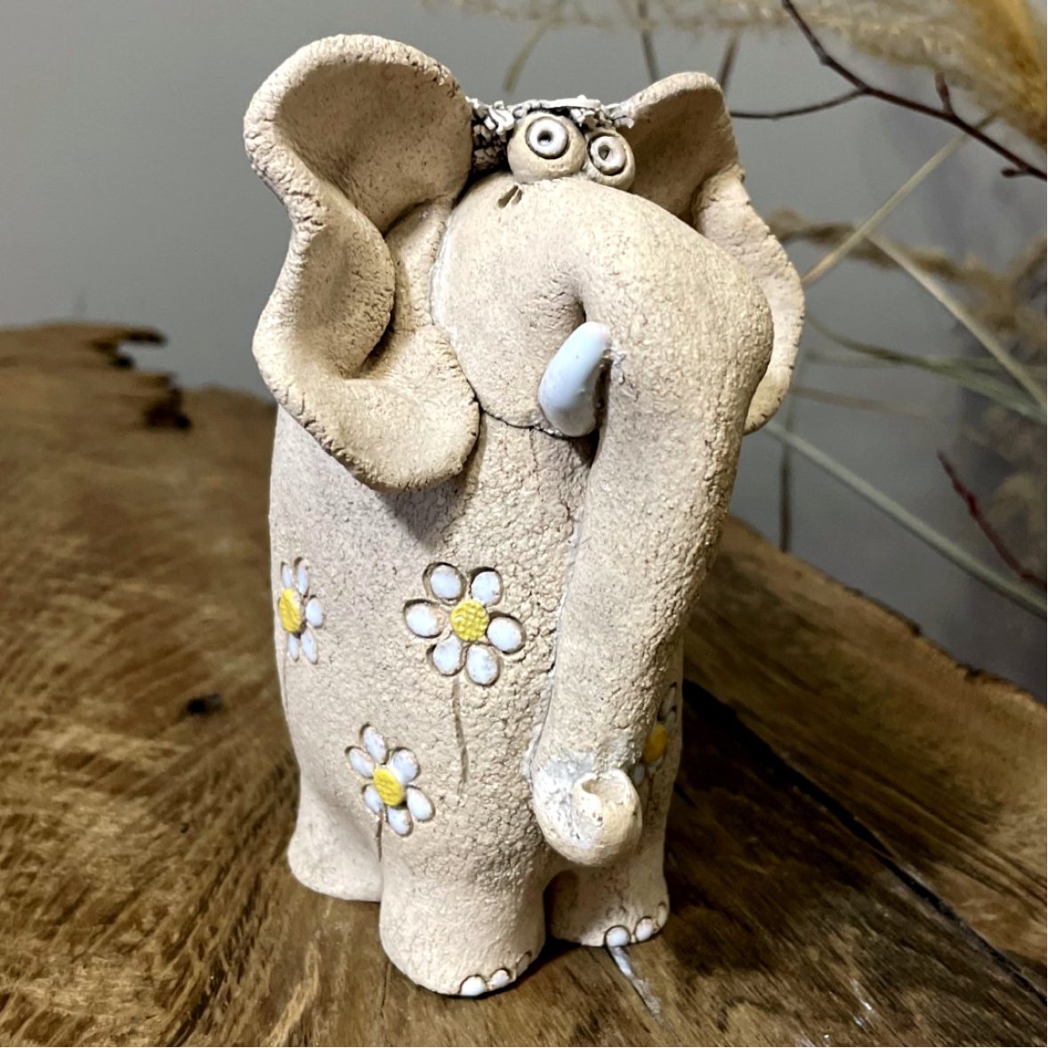 Handmade ceramic elephant figurine with textured surface