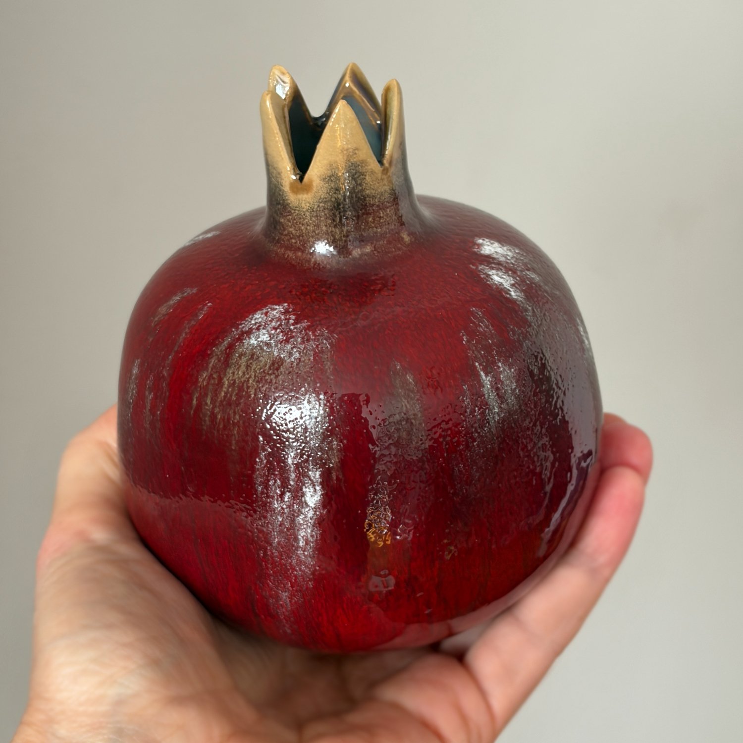 Handmade red ceramic pomegranate vase with sculpted crown