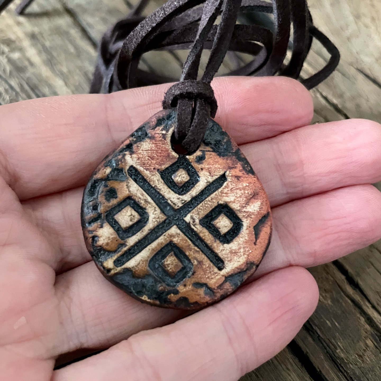 Handmade ceramic pendant with Makosh symbol